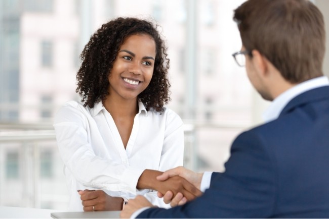 Woman speaking to boss about leadership training